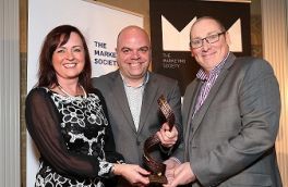 Tony Glover, Research Now, presenting Excellence in Data Analytics award to Audry Munroe and Brendan Sheridan, Experian Ireland